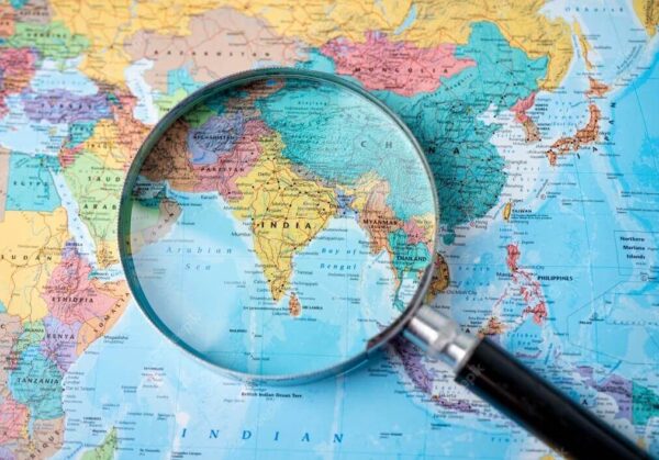 offshore-development-center-in-india.jpeg Magnifying glass focused on map of India for offshore development center